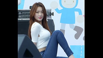 Redheaded Korean woman does erotic dance